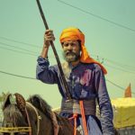 Rod - A man on a horse with a spear and a flag