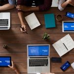 Professionals - Top View Photo Of People Near Wooden Table