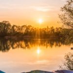 Waters - Three Brown Canoes Under Golden Hour