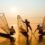 Boat - Three Men Riding Boats on Body of Water