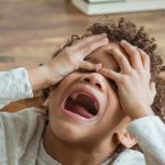 Behaviors - Black boy screaming in room