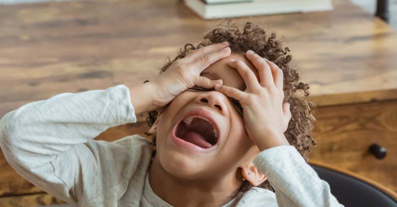 Behaviors - Black boy screaming in room