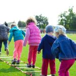 Kids - Children's Team Building on Green Grassland