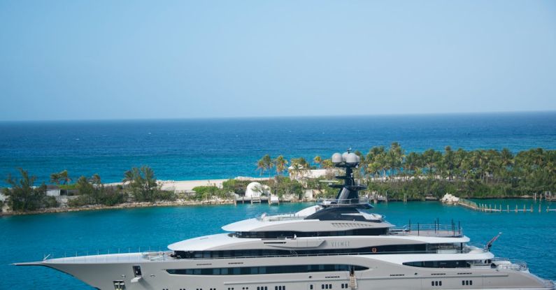 Yacht - White and Blue Yacht on Body of Water