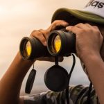 Binoculars - Man Looking in Binoculars during Sunset