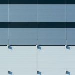 Panels - A close up of a building with blue and white stripes