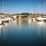 Marina - White Cabin Cruiser on Water
